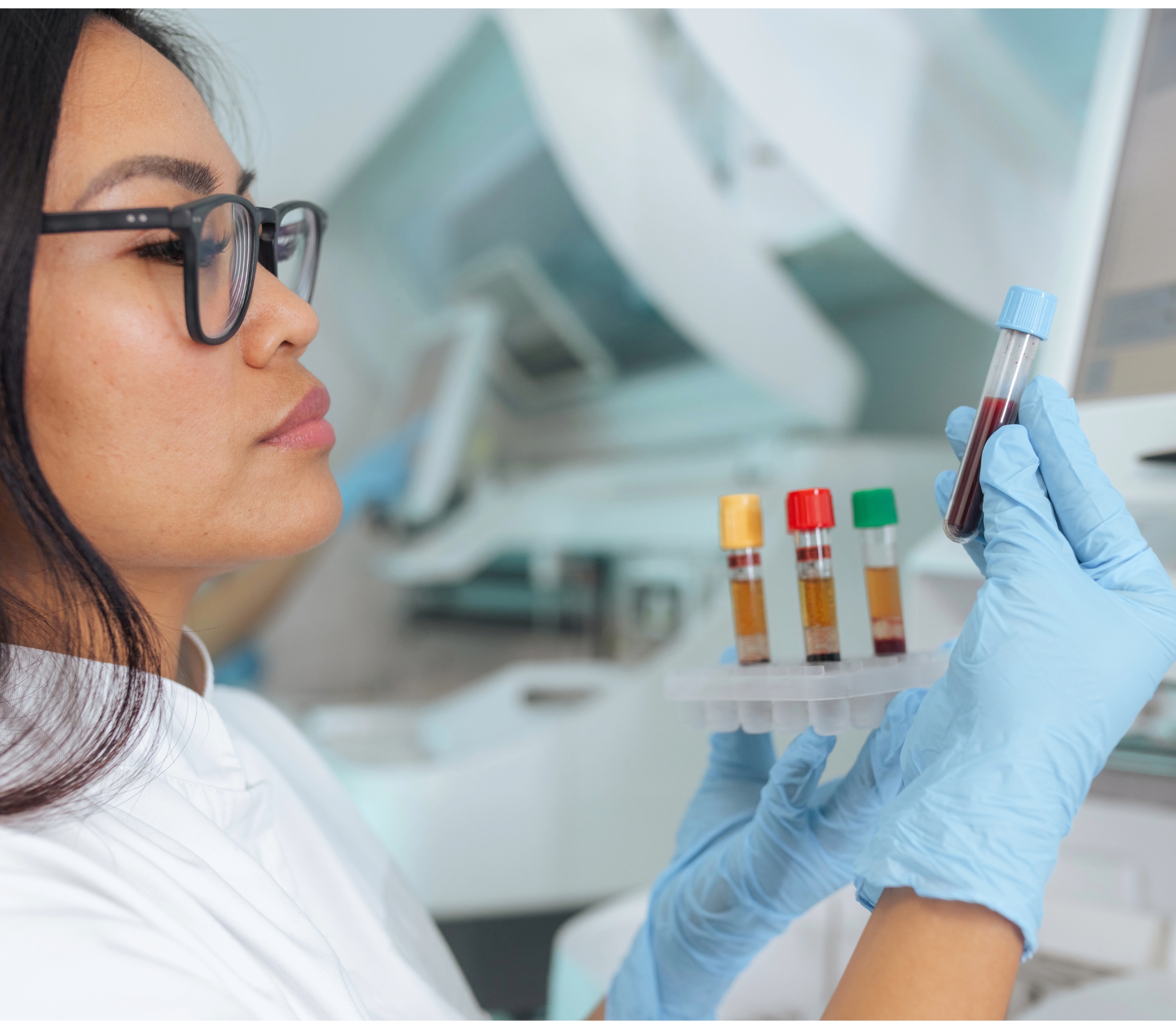 Lab technician inspecting quality-checked sample vials